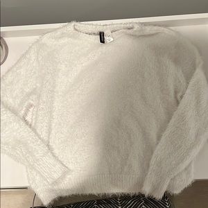 white fuzzy sweater